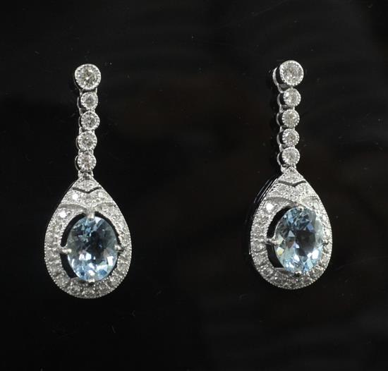 A modern pair of 18ct white gold, aquamarine and diamond set drop earrings, 28mm.